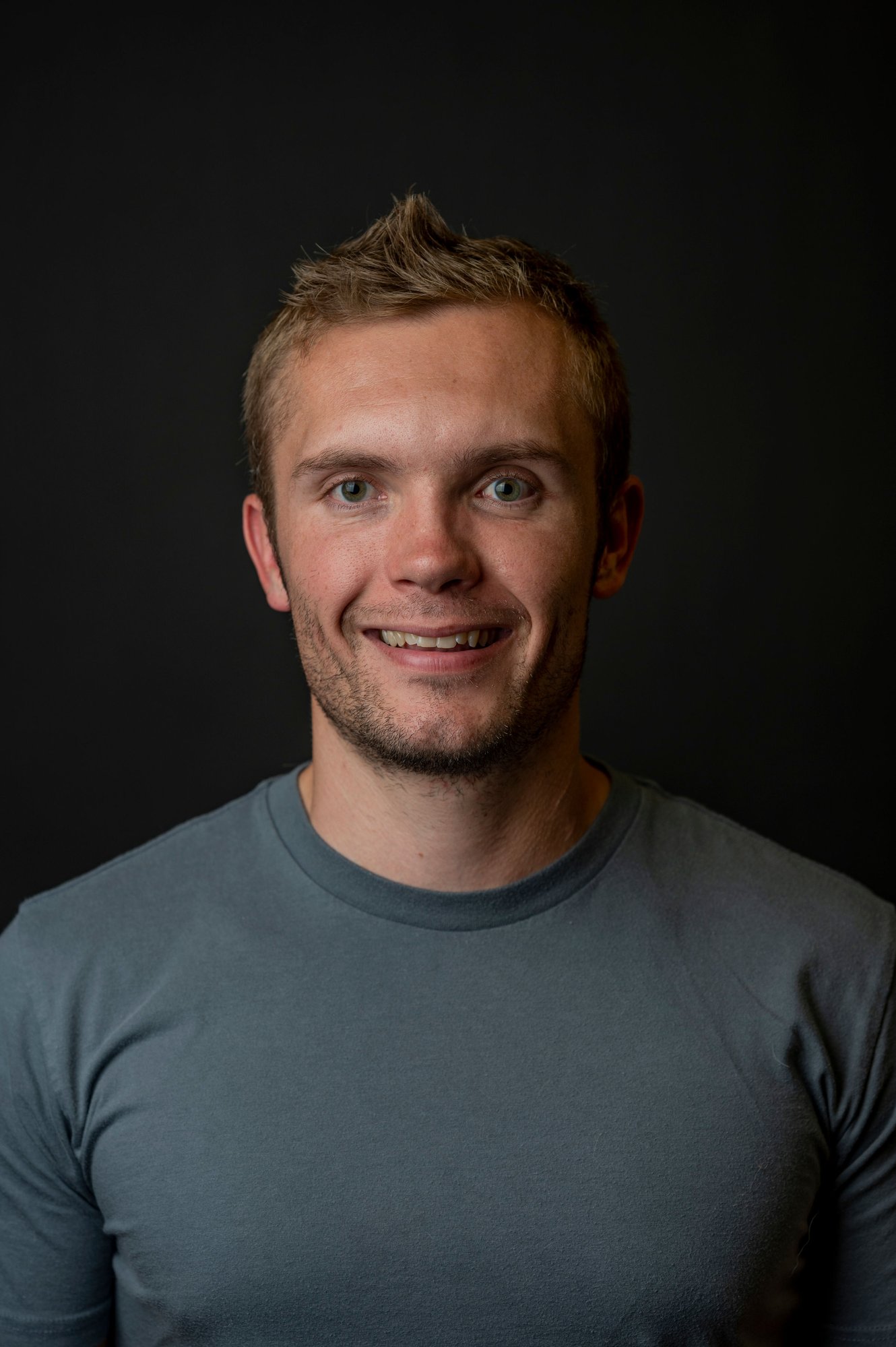 Headshot (Gray Shirt, Smile) 2022